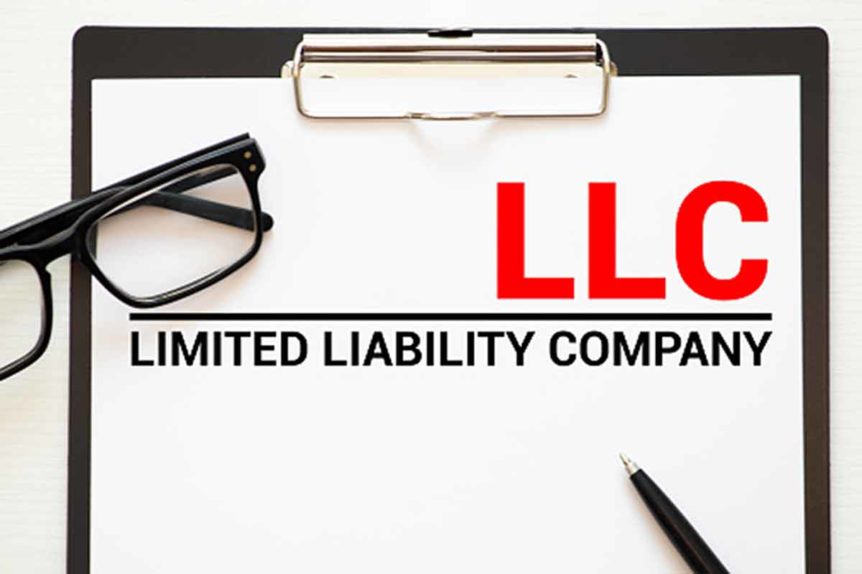 overview of clipboard with LLC printed in large letters and Limited Liability Company underneath
